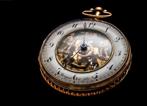 Round Gold-colored Pocket Watch