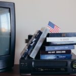 VHS Tapes on Top of a VHS Player