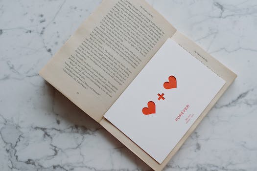 Opened book with valentine lying inside