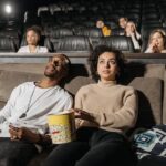 Close-Up Photo of a Couple Watching a Movie Together