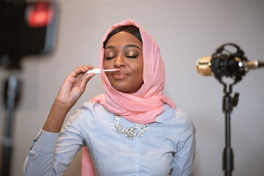 Female Vlogger in Pink Hijab doing a Product Test